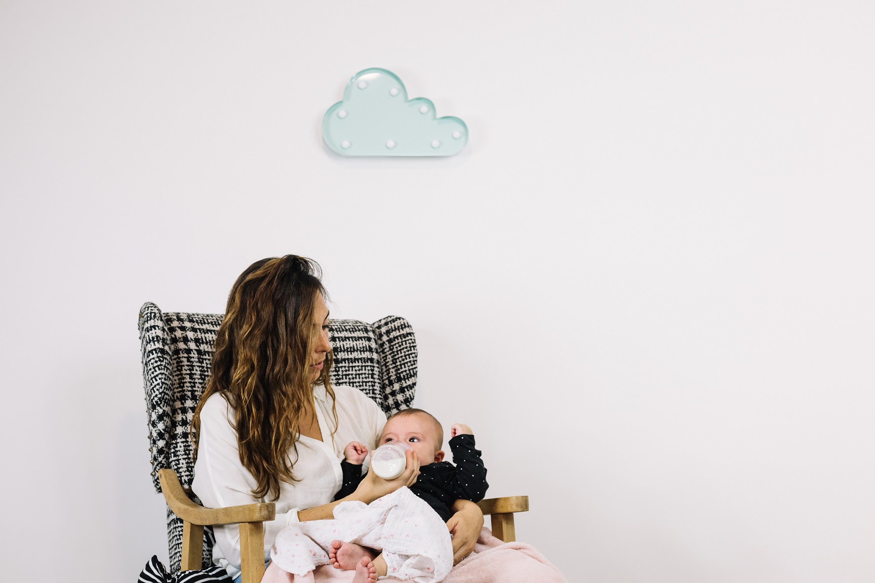 woman-feeding-baby-cloud